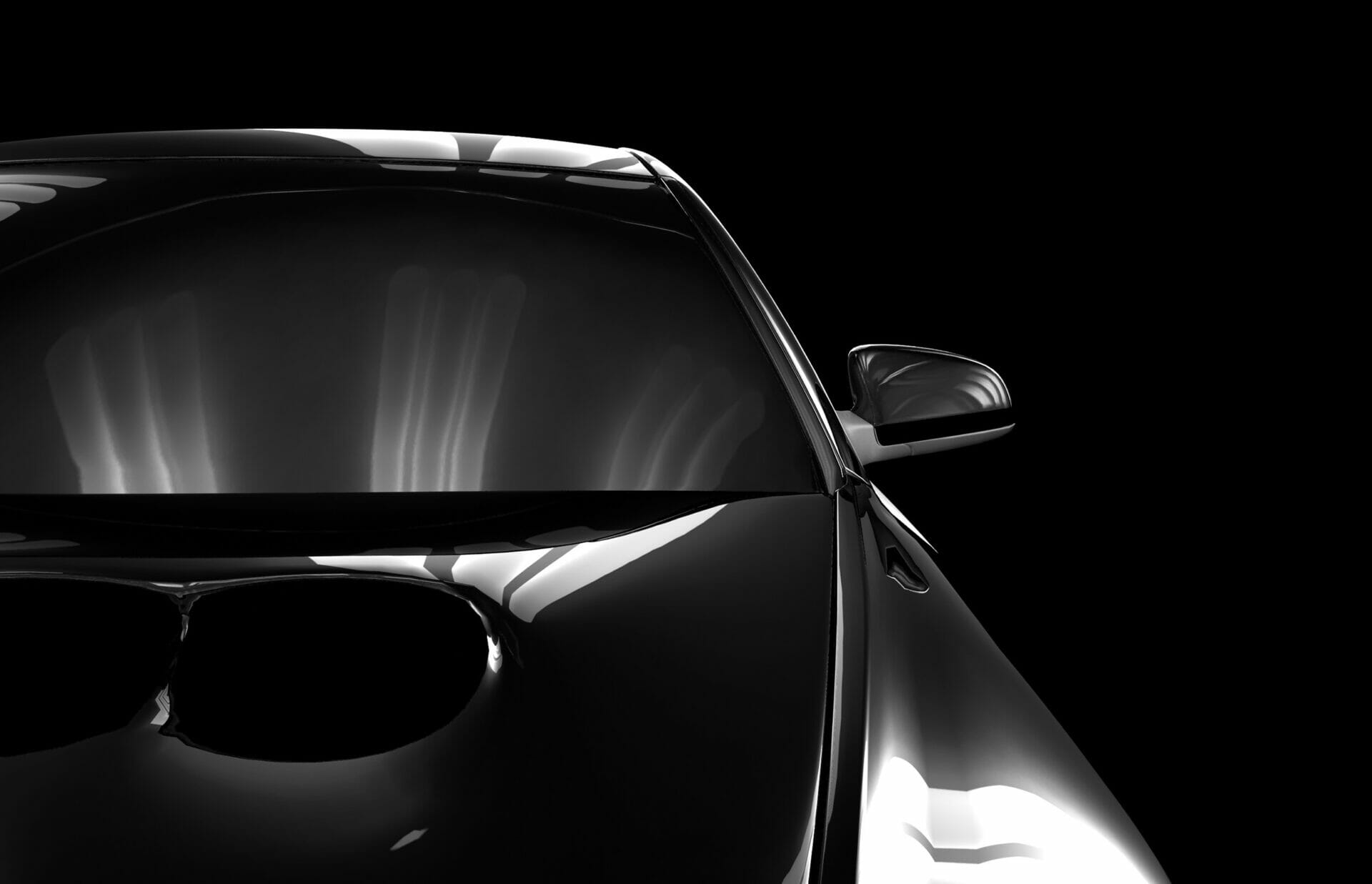 An image of a black car on a black background.