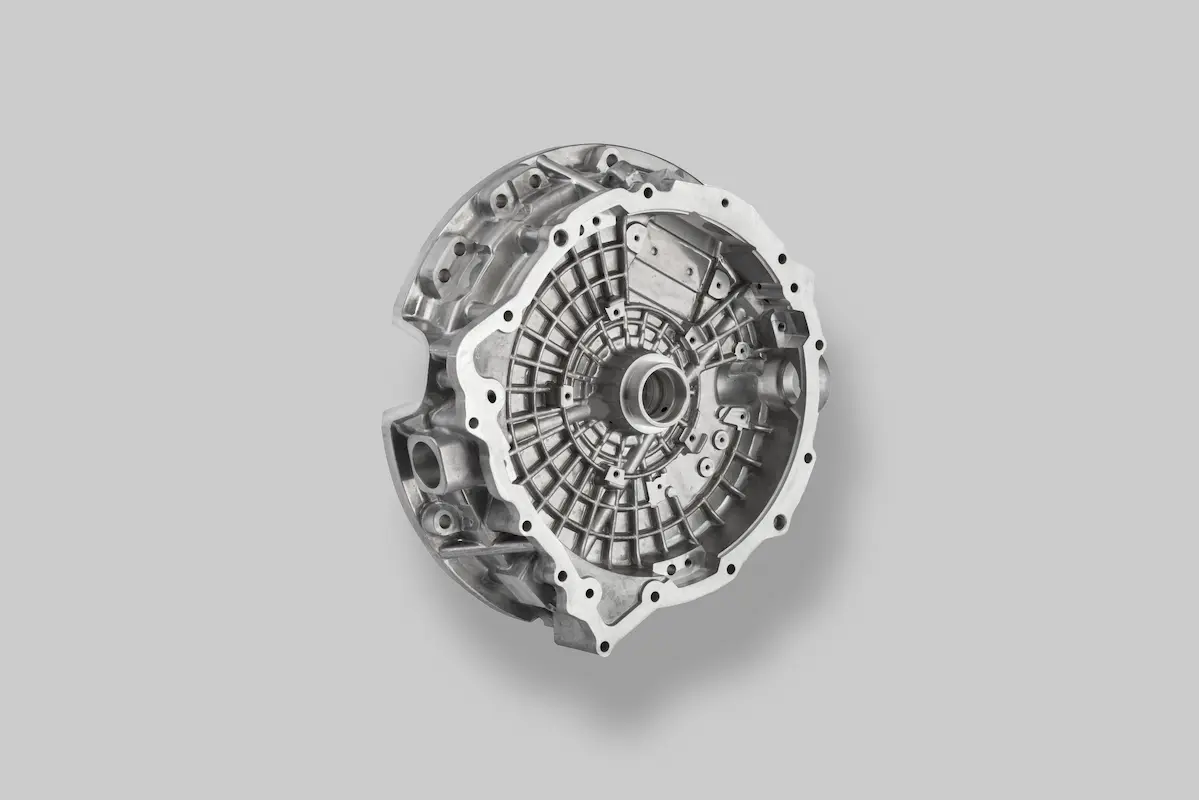 A metallic gearbox casing displayed against a plain gray background.